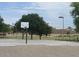 Outdoor basketball court area with lush landscaping and view of residential homes at 18599 W Illini St, Goodyear, AZ 85338