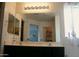 Bathroom boasting a large mirror, dual sinks, and vanity at 18599 W Illini St, Goodyear, AZ 85338