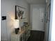 Inviting entryway features console table decor and a calming bull wall art piece at 18599 W Illini St, Goodyear, AZ 85338