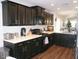 Stylish kitchen boasts sleek cabinetry, white countertops, and modern stainless appliances at 18599 W Illini St, Goodyear, AZ 85338
