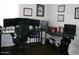 Spacious home office featuring multiple monitors and work surfaces at 18599 W Illini St, Goodyear, AZ 85338