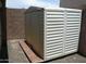 Outdoor white storage shed with desert landscaping and block fence at 18599 W Illini St, Goodyear, AZ 85338
