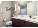 Well-lit bathroom featuring a spacious countertop and ample storage space for toiletries and bathroom essentials at 18653 W Mescal St, Surprise, AZ 85388