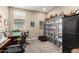 Well-furnished bedroom featuring ample storage options and a comfortable sitting area for relaxation and leisure at 18653 W Mescal St, Surprise, AZ 85388