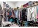 Walk-in closet with built-in shelving and racks for organized storage at 18653 W Mescal St, Surprise, AZ 85388