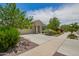 Lovely single-story residence with a desert landscape and long driveway at 18653 W Mescal St, Surprise, AZ 85388