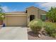 Inviting single-story home featuring a two-car garage and low maintenance landscaping at 18653 W Mescal St, Surprise, AZ 85388