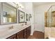 Bathroom with double sinks, framed mirrors and separate shower at 19606 N 23Rd Way, Phoenix, AZ 85024