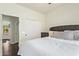Bright bedroom featuring a closet, dark wood floors, and a comfortable bed at 19606 N 23Rd Way, Phoenix, AZ 85024