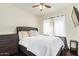 Comfortable bedroom with ceiling fan, dresser, and neutral colored decor at 19606 N 23Rd Way, Phoenix, AZ 85024