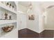 Bright foyer featuring hardwood floors and decorative shelving at 19606 N 23Rd Way, Phoenix, AZ 85024