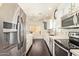 Bright kitchen featuring stainless steel appliances, white cabinets and breakfast nook at 19606 N 23Rd Way, Phoenix, AZ 85024