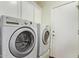 Functional laundry room featuring LG washer and dryer appliances and white door for convenient chores at 19606 N 23Rd Way, Phoenix, AZ 85024