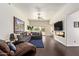 Comfortable living room with a large sectional sofa and a sliding glass door at 19606 N 23Rd Way, Phoenix, AZ 85024