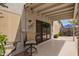 Charming covered patio with tiled flooring and outdoor seating, perfect for relaxing and entertaining at 19606 N 23Rd Way, Phoenix, AZ 85024