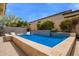 Resort style pool with a waterfall feature, hot tub and submerged loungers with blue tile at 19606 N 23Rd Way, Phoenix, AZ 85024