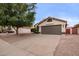 Charming single-story home featuring a well-manicured front yard and a neutral paint scheme at 2027 S Rowen St, Mesa, AZ 85209