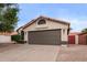 Charming single-story home featuring a well-manicured front yard and a neutral paint scheme at 2027 S Rowen St, Mesa, AZ 85209