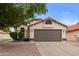 Charming single-story home featuring a well-manicured front yard and a neutral paint scheme at 2027 S Rowen St, Mesa, AZ 85209