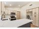 Open kitchen with stainless steel appliances, light cabinets, a black faucet, and quartz countertops at 2027 S Rowen St, Mesa, AZ 85209