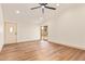 Spacious living room featuring vaulted ceilings, wood floors, and ample natural light at 2027 S Rowen St, Mesa, AZ 85209