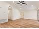 Spacious living room featuring vaulted ceilings, wood floors, and ample natural light at 2027 S Rowen St, Mesa, AZ 85209