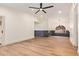 Spacious living room featuring vaulted ceilings, wood floors, and ample natural light at 2027 S Rowen St, Mesa, AZ 85209