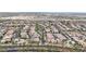 This aerial view shows the neighborhood's manicured landscaping and views of construction on nearby lots at 20421 W Legend Trl, Buckeye, AZ 85396