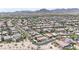 This aerial view captures the well-maintained community surrounded by desert landscape and mountain views at 20421 W Legend Trl, Buckeye, AZ 85396