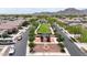 This aerial view shows a community's unique median, landscaping, and recreational vehicle parking at 20421 W Legend Trl, Buckeye, AZ 85396