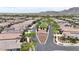 This aerial view shows the neighborhood's landscaped median and well-maintained desert landscaping at 20421 W Legend Trl, Buckeye, AZ 85396