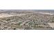This aerial showcases well-planned neighborhood layouts with numerous homes and landscaped streets in the desert landscape at 20421 W Legend Trl, Buckeye, AZ 85396