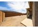 Open backyard space with views of the neighborhood fence and rear patio at 20421 W Legend Trl, Buckeye, AZ 85396