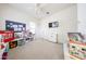 Bright bedroom featuring neutral carpet, white walls, and lots of natural light at 20421 W Legend Trl, Buckeye, AZ 85396