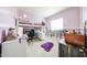 Bedroom with lofted bed, desk, and shelves at 20421 W Legend Trl, Buckeye, AZ 85396