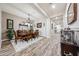 Formal dining room featuring wood flooring, a decorative chandelier, and seating for six guests at 20421 W Legend Trl, Buckeye, AZ 85396