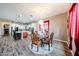 Elegant dining area with a chandelier, traditional furniture, and nearby kitchen at 20421 W Legend Trl, Buckeye, AZ 85396