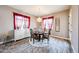 Dining room with chandelier and a bright window, offering ample natural light at 20421 W Legend Trl, Buckeye, AZ 85396
