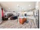 Open kitchen layout with center island, farm sink, and views into the living room at 20421 W Legend Trl, Buckeye, AZ 85396