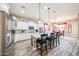 Bright kitchen with granite countertops, stainless steel appliances, and breakfast bar seating four at 20421 W Legend Trl, Buckeye, AZ 85396