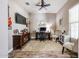 Home office space with dark wood furniture, plush rug, neutral paint, and guitar wall decor at 20421 W Legend Trl, Buckeye, AZ 85396