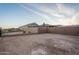 The spacious backyard is enclosed with a block wall, ready for landscaping at 20961 W Pasadena Ave, Buckeye, AZ 85396