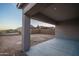 The backyard features a covered patio and a blank canvas for your outdoor dreams at 20961 W Pasadena Ave, Buckeye, AZ 85396