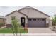 Charming single-story home with stone accents, neutral color scheme, and two car garage at 20961 W Pasadena Ave, Buckeye, AZ 85396