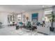 Bright and open living room with modern decor, stylish furniture, and lots of seating at 20961 W Pasadena Ave, Buckeye, AZ 85396