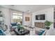 Cozy living room with plank accent wall, comfortable seating, and sliding glass doors at 20961 W Pasadena Ave, Buckeye, AZ 85396