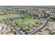 Enjoy this aerial view of a community with a soccer field, water features, and homes at 211 W New Dawn Dr, Chandler, AZ 85248