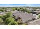 Overhead view of desert home highlighting clay tile roof and lush desert landscaping at 211 W New Dawn Dr, Chandler, AZ 85248