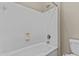 Clean, well-maintained tub and shower combination bathroom features all white finishes at 211 W New Dawn Dr, Chandler, AZ 85248