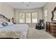 Relaxing bedroom featuring a large window and a massage chair offering the ultimate relaxation experience at 211 W New Dawn Dr, Chandler, AZ 85248